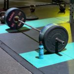 Iron Discipline photo of loaded Olympic bar in gym